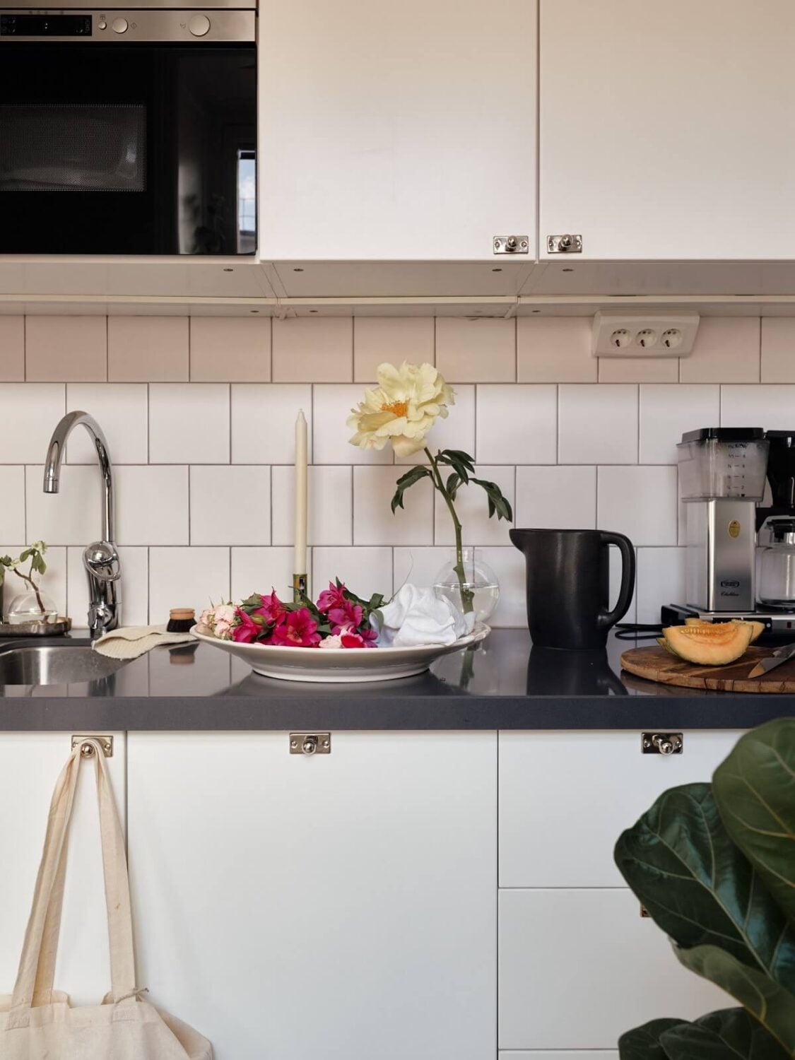 A Small Swedish Apartment with Ochre Yellow Sofa 12 white-kitchen-cabinets-nordic-apartment-nordroom