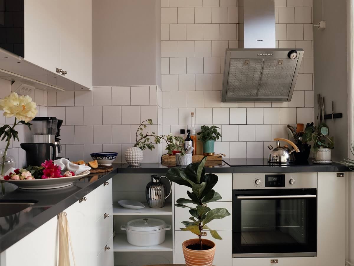A Small Swedish Apartment with Ochre Yellow Sofa 11 white-kitchen-cabinets-white-tiles-nordroom