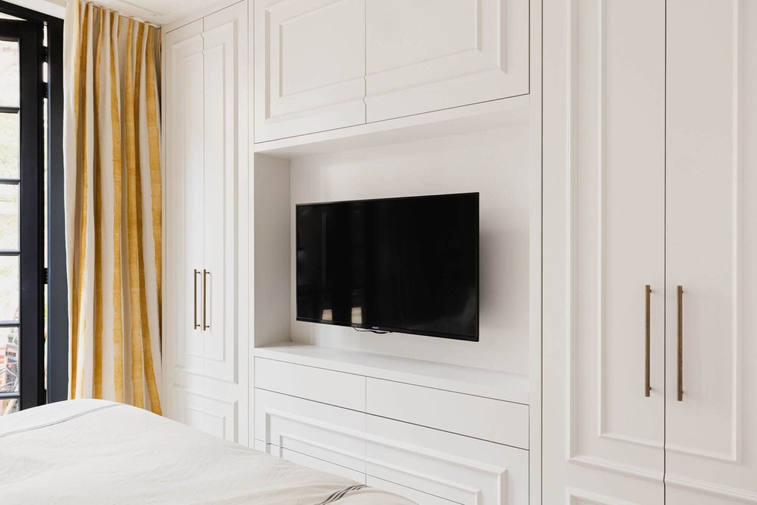 Color and Wallpaper in a Stylish Amsterdam Home 14 white-master-bedroom-built-in-wardrobes-nordroom