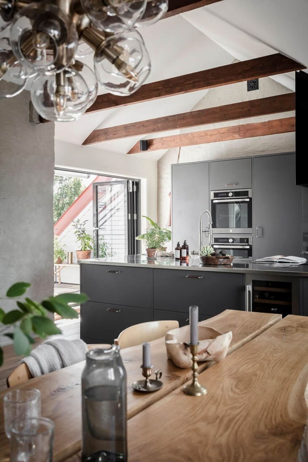 A Swedish Maisonette with Warm Pink Living Room 3 attic-kitchen-stainless-steel-nordroom