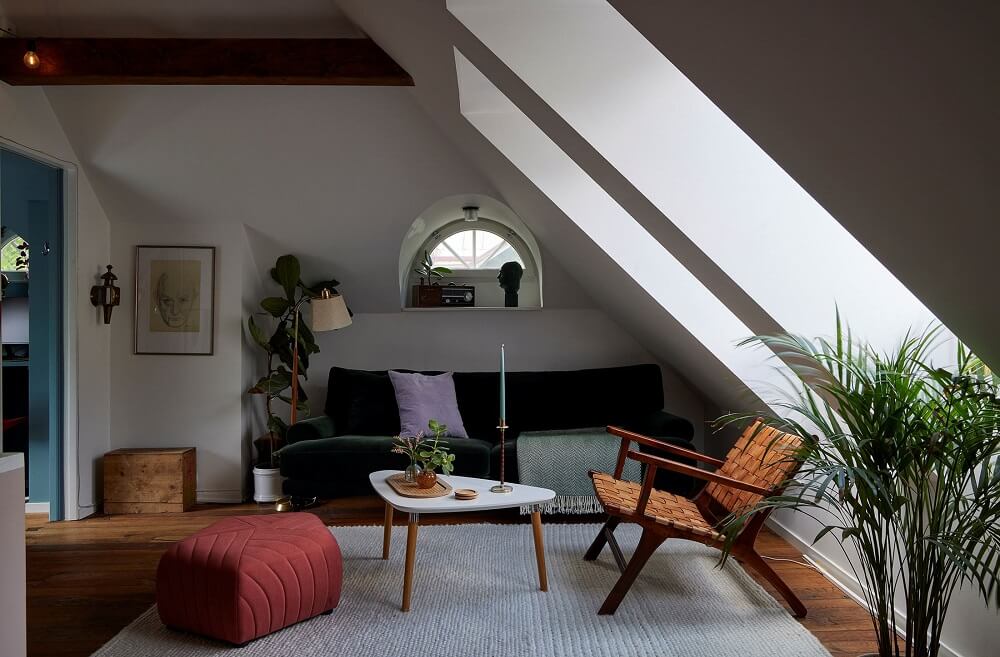 A Split-Level Attic Apartment with Blue Bedroom 6 attic-living-room-velvet-green-sofa-nordroom