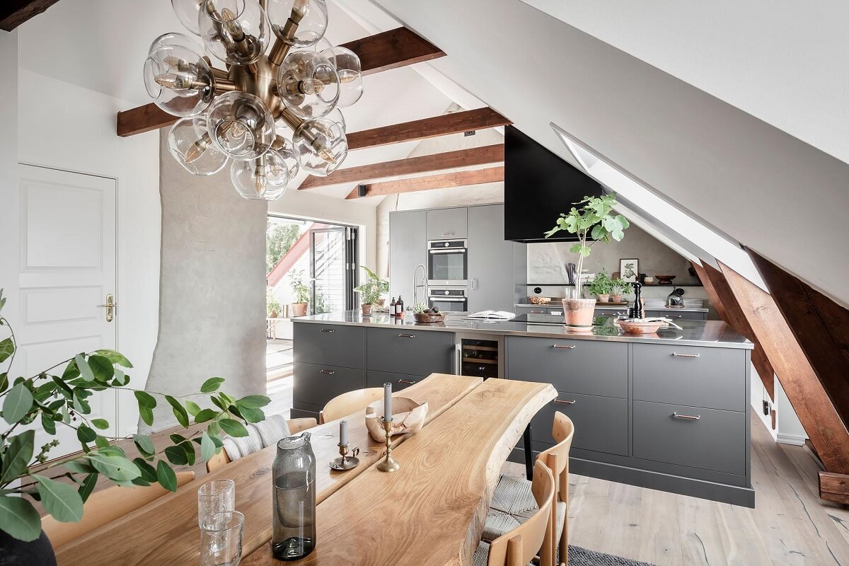 A Swedish Maisonette with Warm Pink Living Room 2 attic-room-stainless-steel-kitchen-wooden-table-beams-nordroom