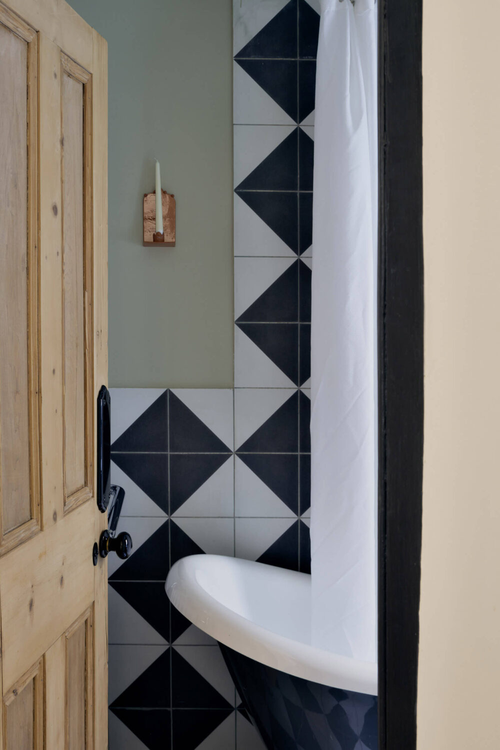 Inspiring Bathrooms With Geometric Tiles 19 bathroom-gray-walls-black-white-tiles-freestanding-bath-nordroom
