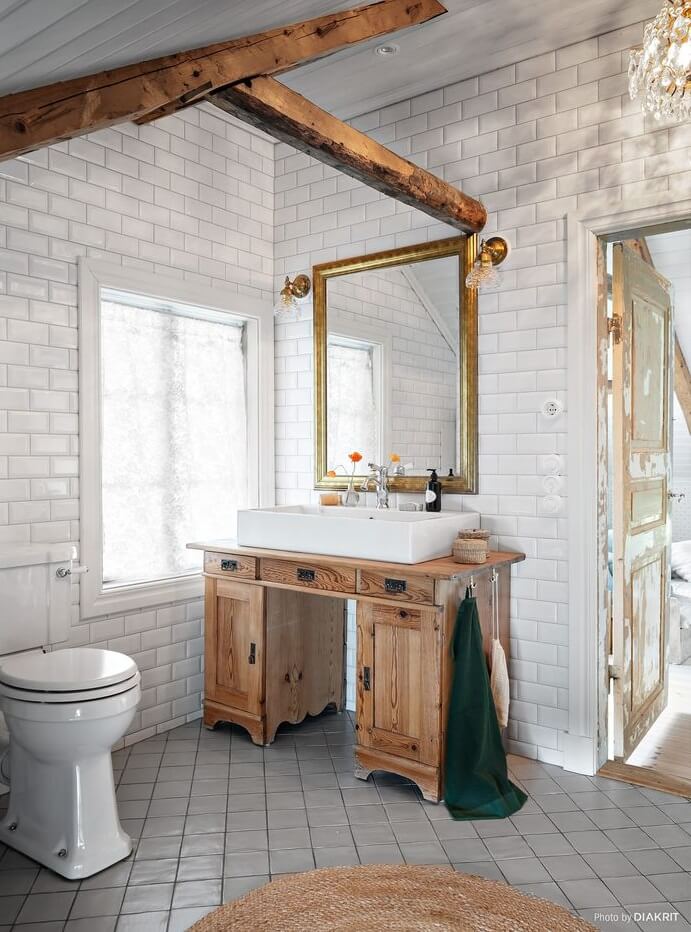 A Charming Swedish Villa Filled with Wallpaper 20 bathroom-metro-tiles-exposed-beams-nordroom