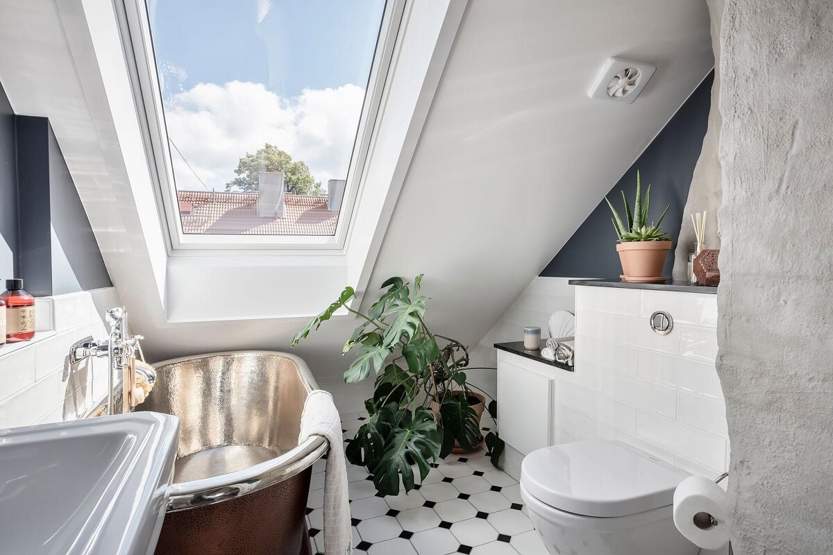 A Swedish Maisonette with Warm Pink Living Room 18 bathroom-sloped-ceiling-gray-walls-copper-bath-nordroom