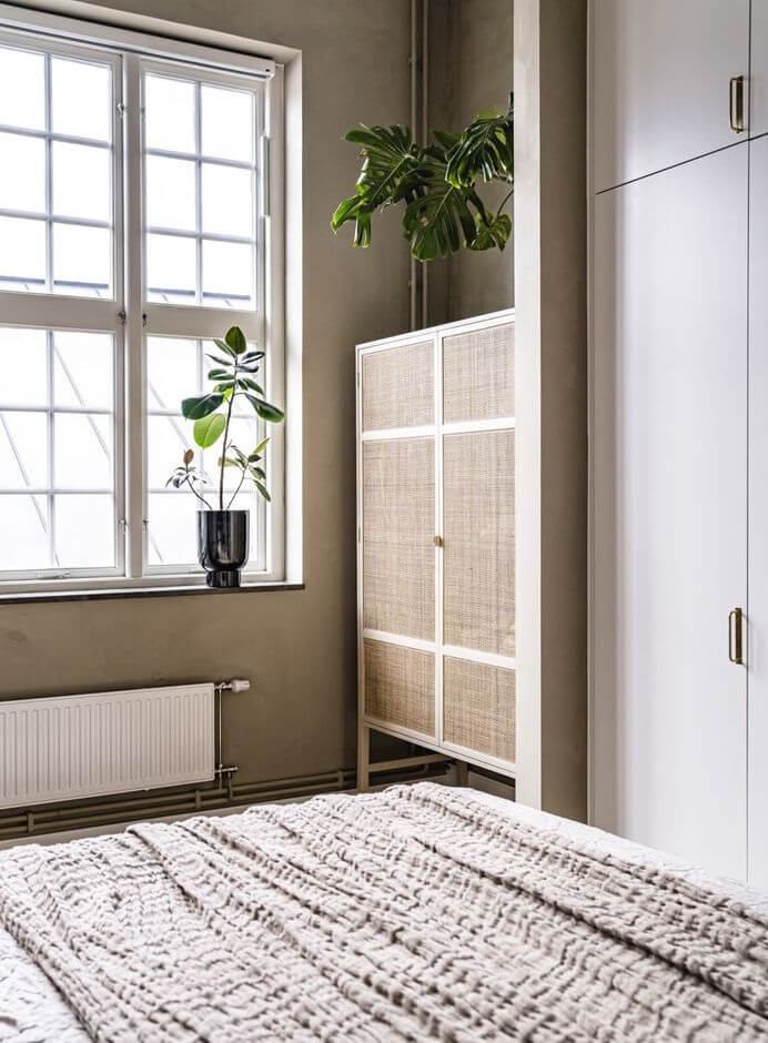A Historic Factory Transformed Into A Stylish Home 23 bedroom-beige-walls-ikea-cabinet-nordroom