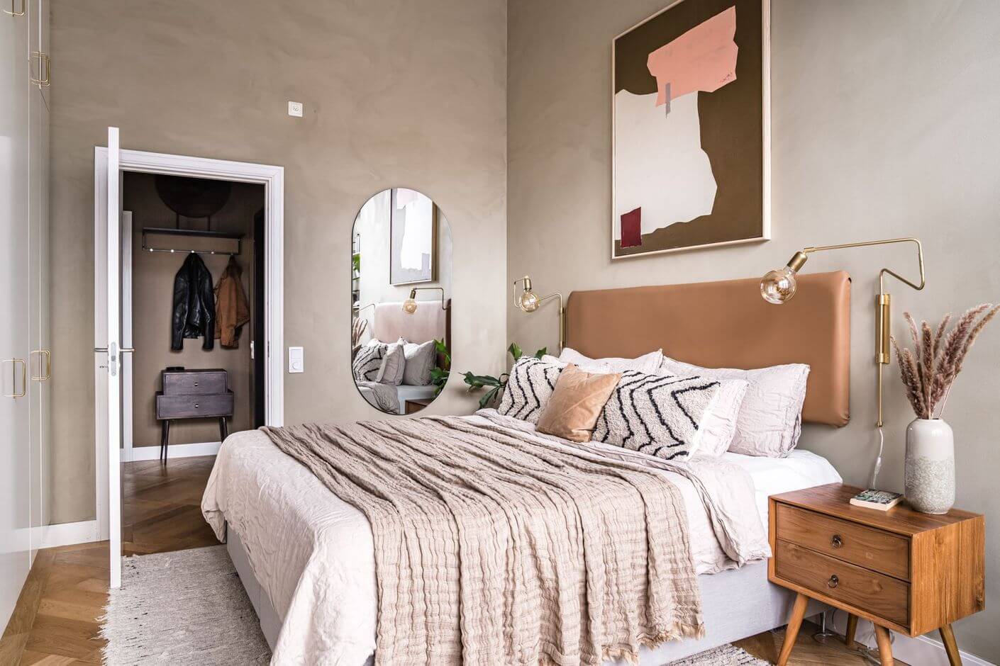 A Historic Factory Transformed Into A Stylish Home 26 bedroom-leather-headboard-natural-colors-nordroom