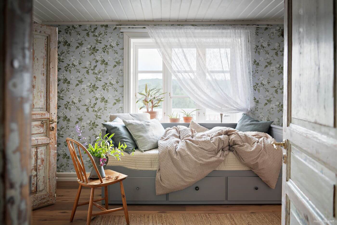 A Charming Swedish Villa Filled with Wallpaper 11 bedroom-wallpaper-rustic-wooden-doors-ikea-sofabed-nordroom