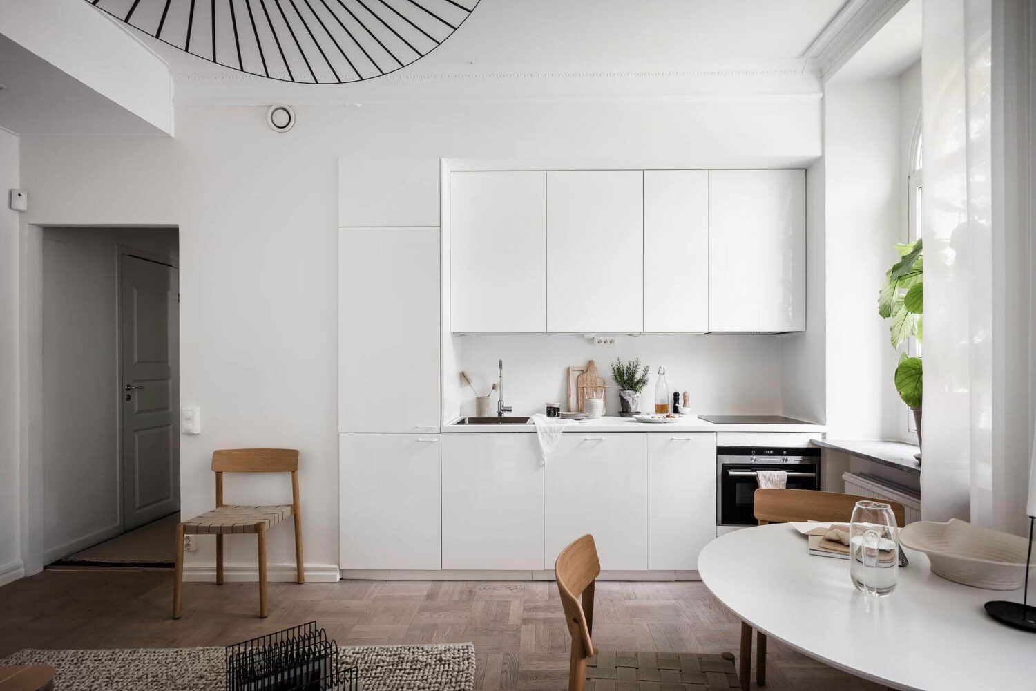 A Tiny and Stylish Nordic Apartment 10 built-in-white-kitchen-minimalistic-nordroom