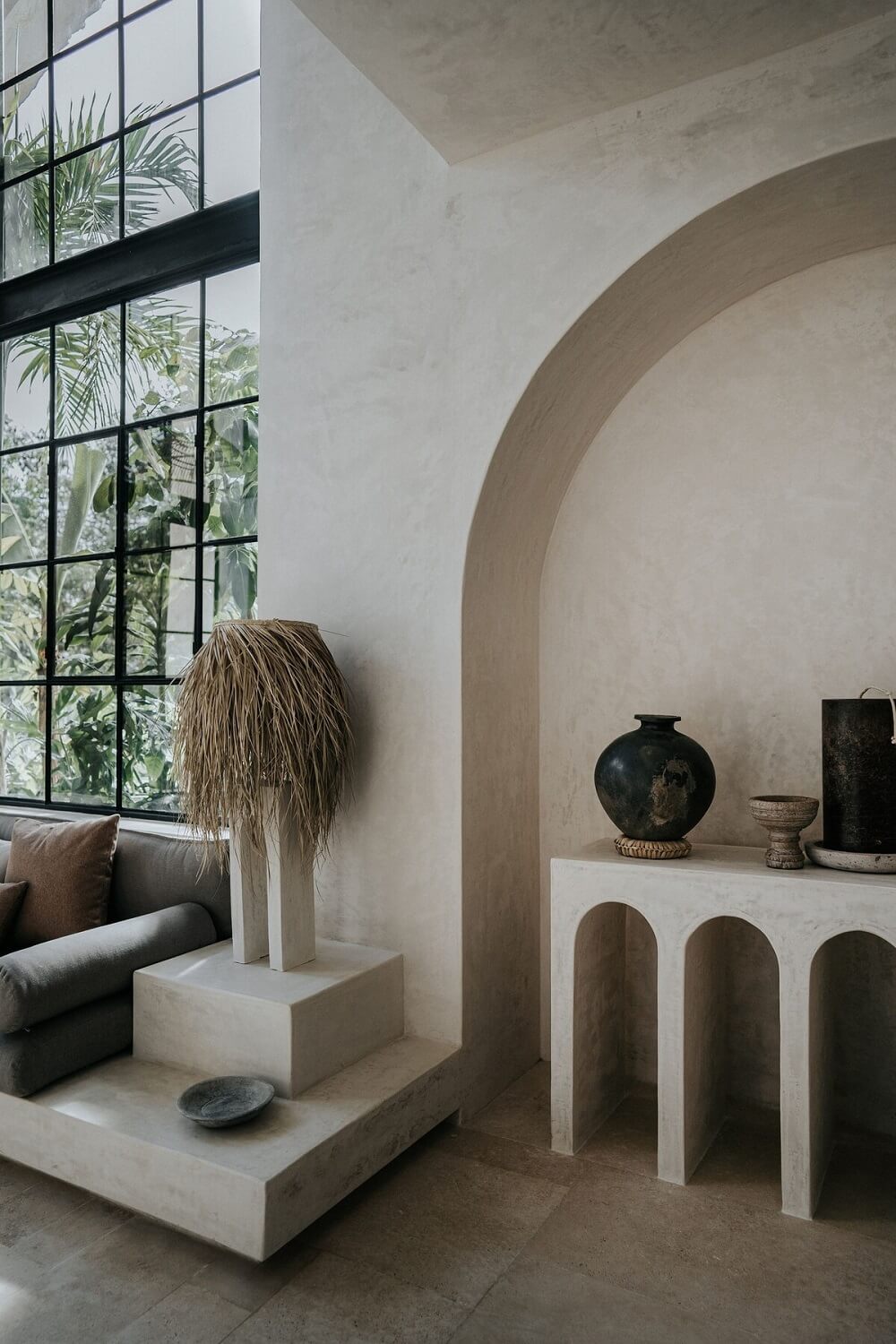 A Serene Apartment in Tulum with High Ceilings and Rooftop Pool 5 concrete-architecture-arched-feature-airbnb-tulum-nordroom