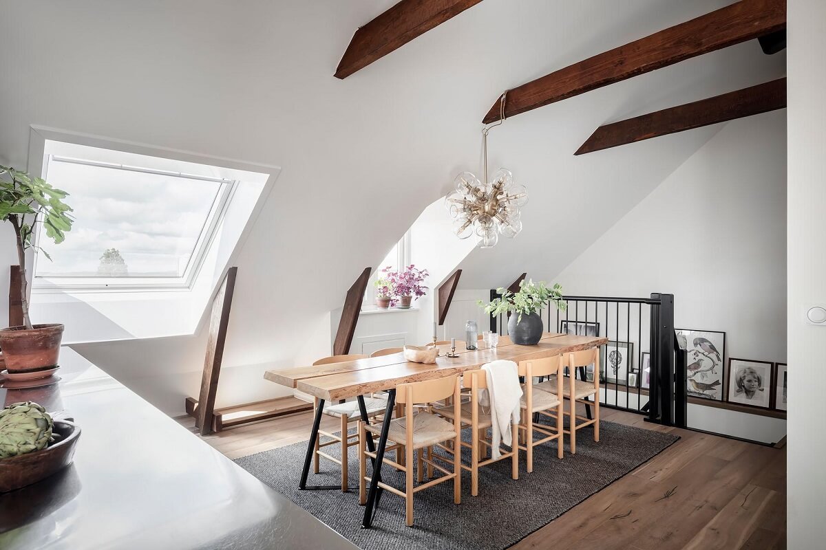 A Swedish Maisonette with Warm Pink Living Room 6 dining-area-social-kitchen-space-sloped-ceiling-wooden-beams-nordroom