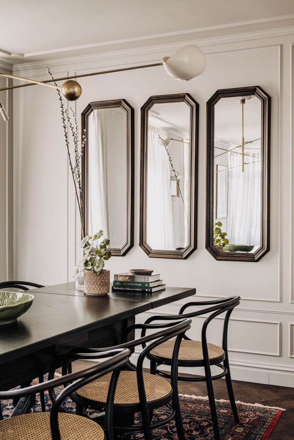 A Luxurious Canal House in Amsterdam 14 dining-room-cane-chairs-mirrors-nordroom