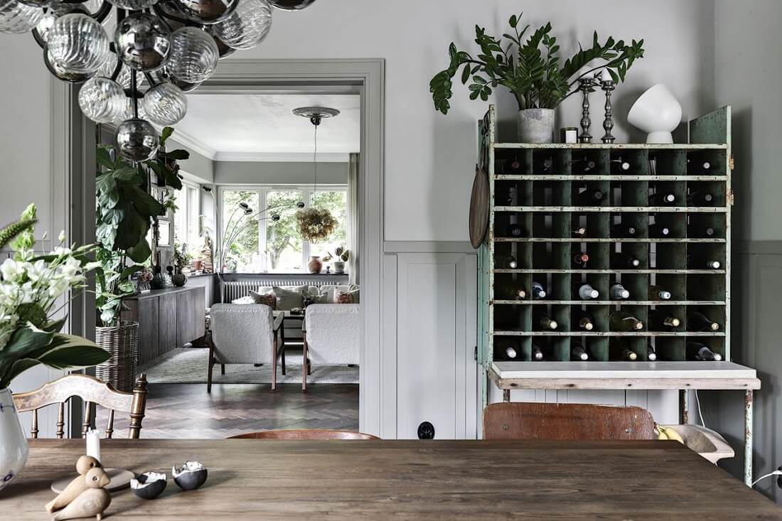 A Swedish 1930s Villa Decorated in Gray and Green Tones 10 dining-room-wine-storage-nordroom