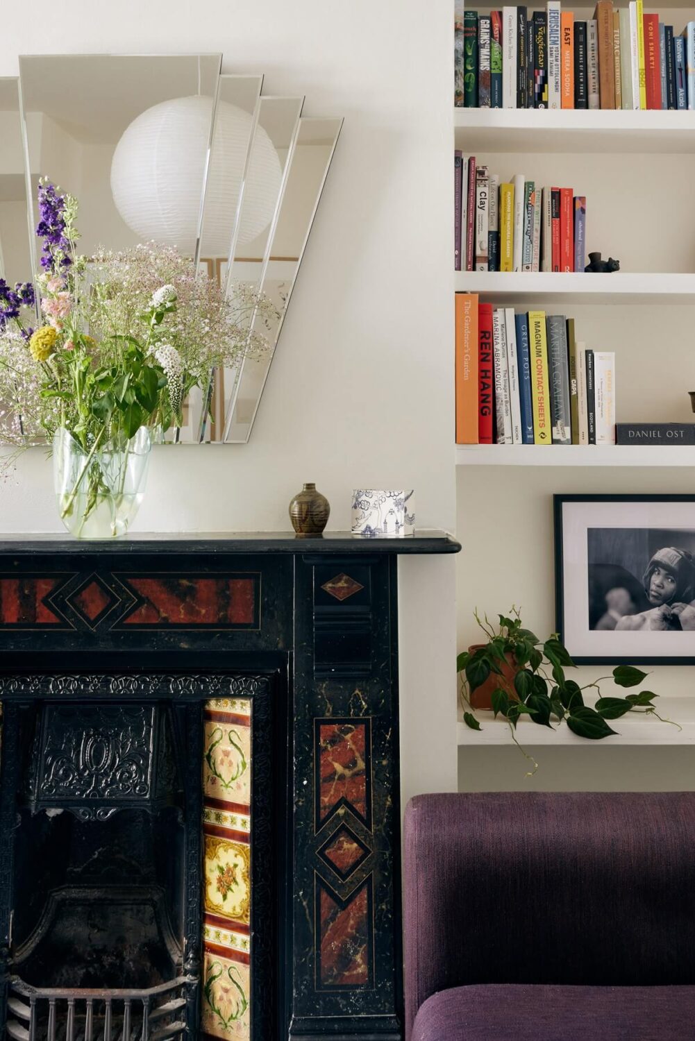 A One-Bedroom Apartment with Colorful Rooms 3 edwardian-fireplace-detail-purple-sofa-nordroom