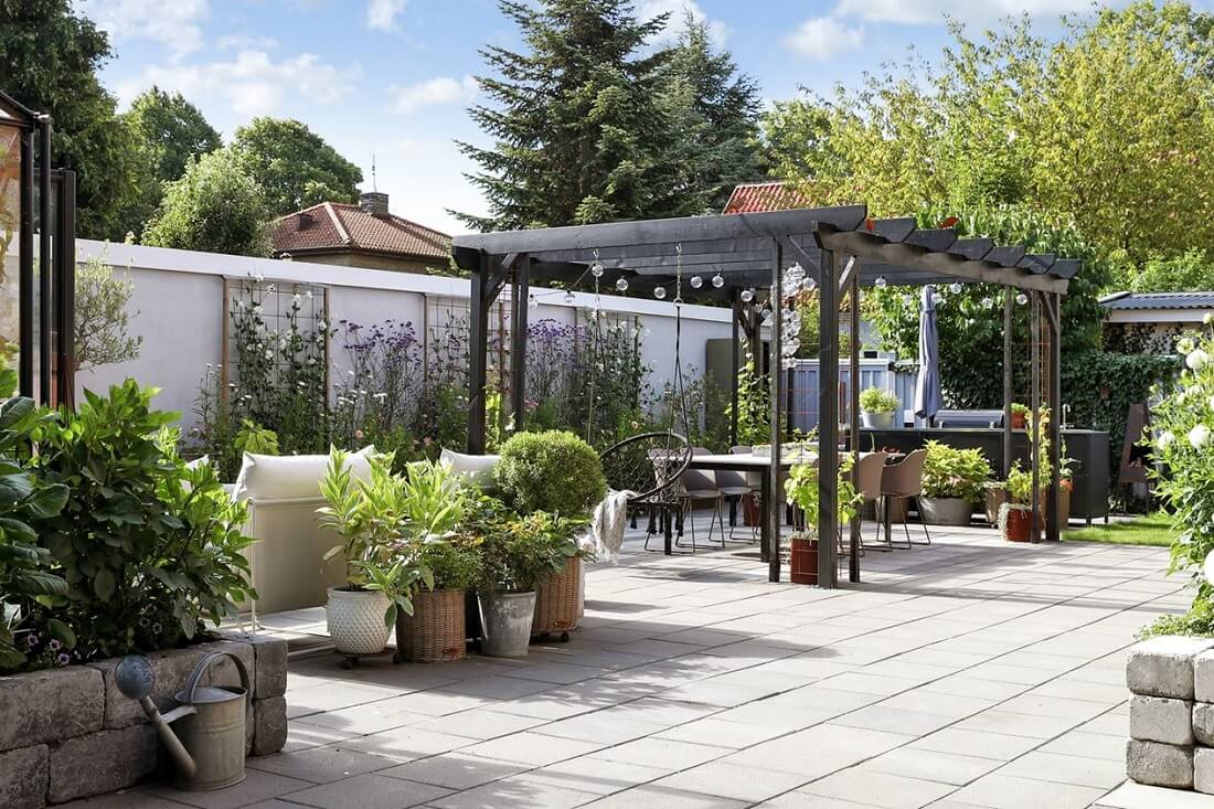 A Swedish 1930s Villa Decorated in Gray and Green Tones 25 garden-dining-area-nordroom