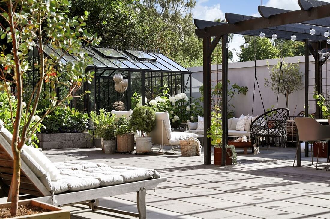 A Swedish 1930s Villa Decorated in Gray and Green Tones 23 garden-greenhouse-lounge-bed-nordroom