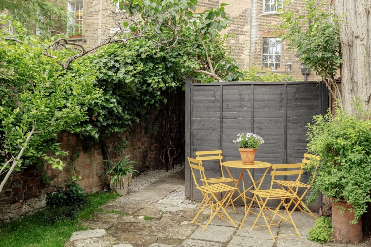 A Serene Period Home in London with Garden 17 garden-terrace-yellow-seating-nordroom