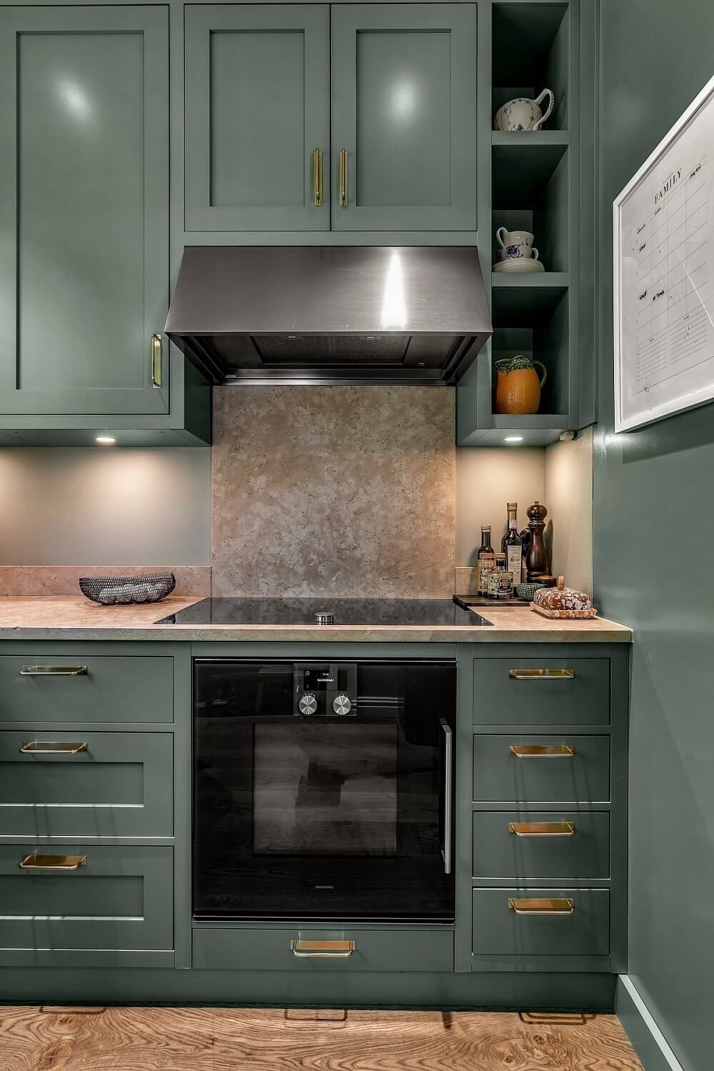 Bold Colors in a 1920s Villa in Sweden 8 green-kitchen-cabinets-brass-handles-nordroom