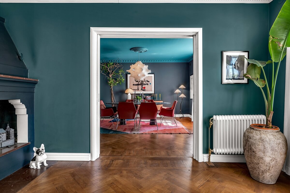Bold Colors in a 1920s Villa in Sweden 5 green-walls-living-room-dining-room-nordroom