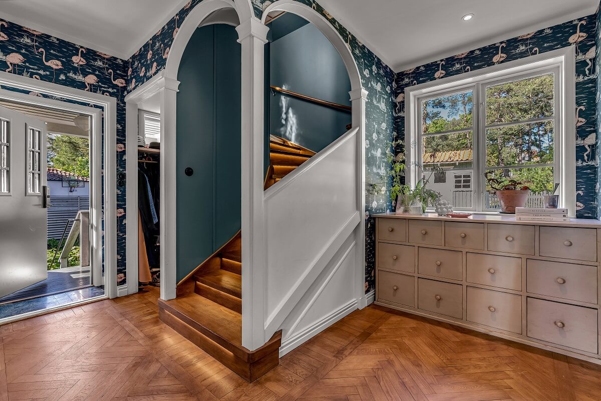 Bold Colors in a 1920s Villa in Sweden 10 hallway-flamingo-wallpaper-wooden-floor-nordroom
