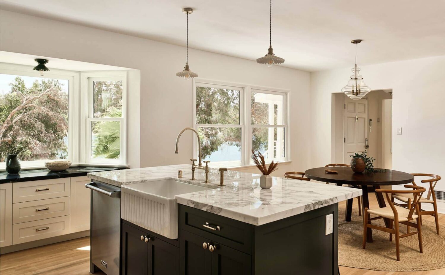 Warm Neutrals in a Lovely Home in Silver Lake, Los Angeles 12 kitchen-island-farmhouse-sink-round-dining-table-nordroom