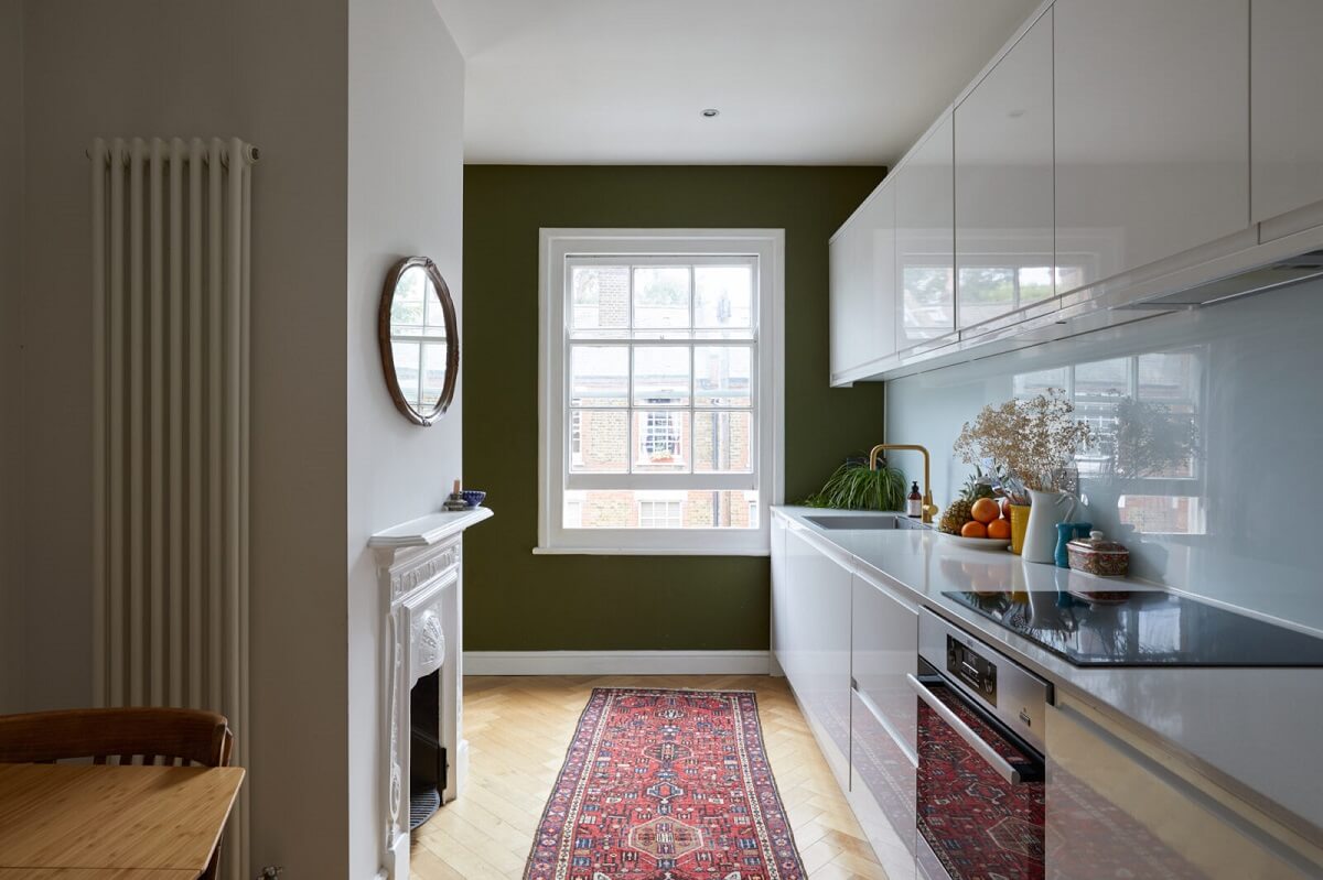 A London Apartment with Olive Green Living Room 7 kitchen-modern-white-cabinets-olive-green-wall-fireplace-nordoom