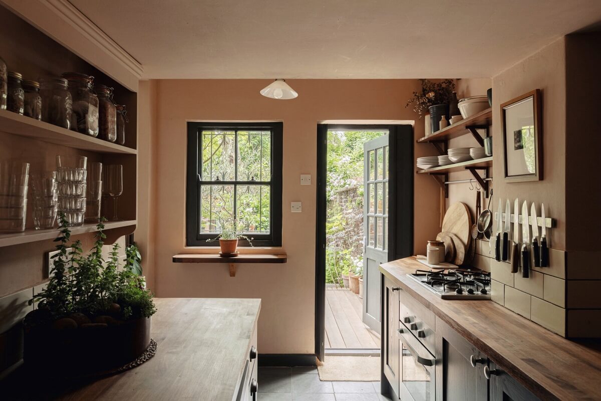 A Serene Period Home in London with Garden 2 kitchen-pink-walls-dark-gray-cabinets-nordroom