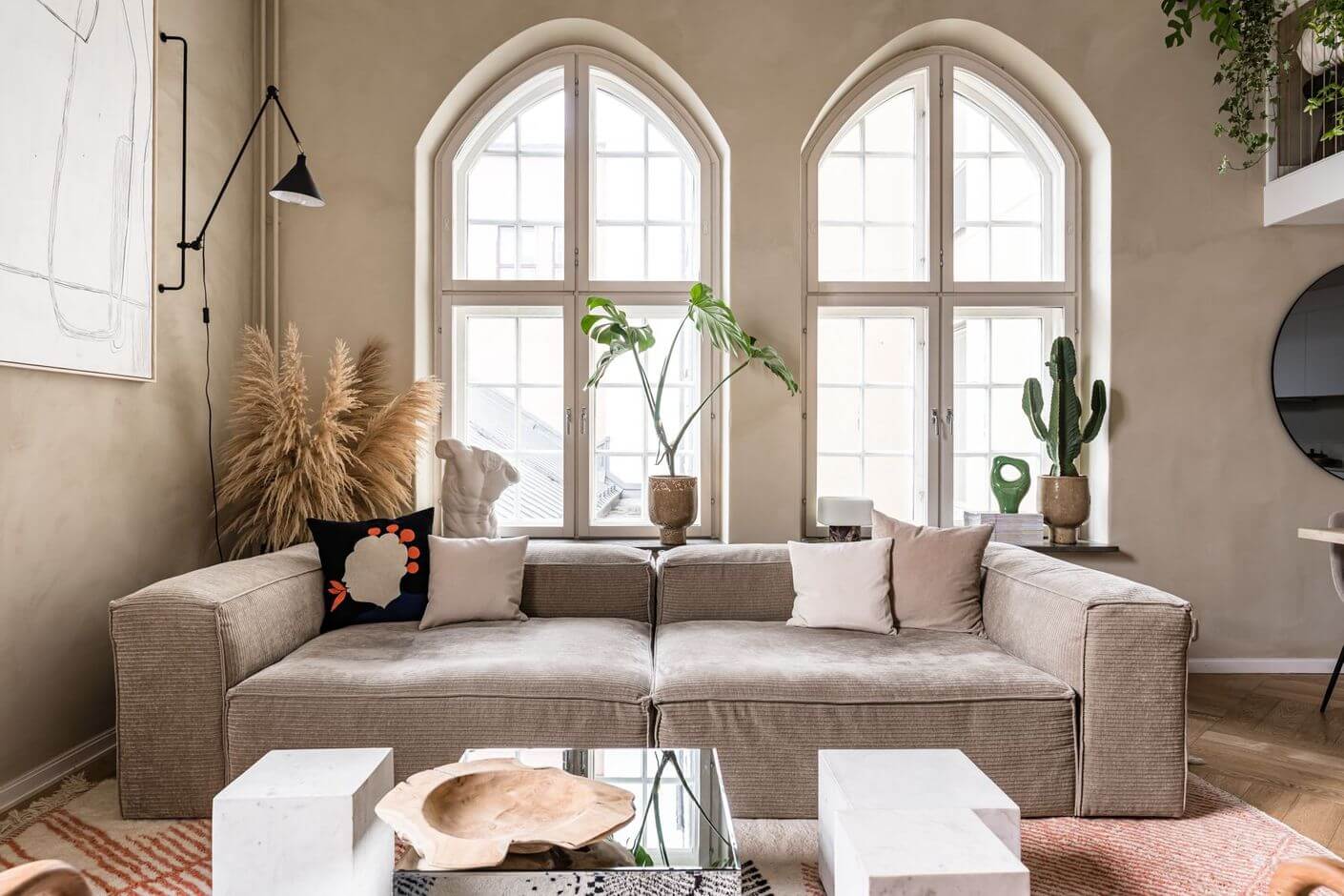 A Historic Factory Transformed Into A Stylish Home 7 living-room-rib-sofa-arched-windows-nordroom