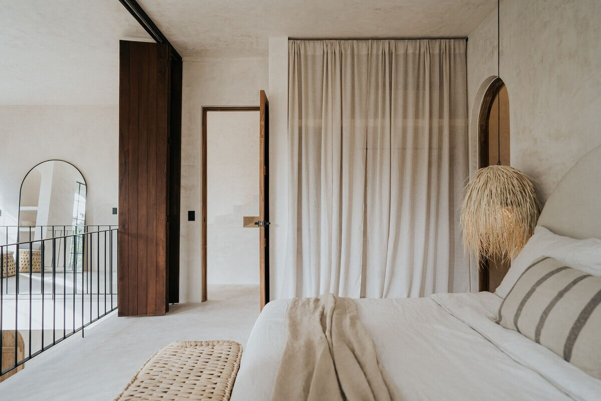 A Serene Apartment in Tulum with High Ceilings and Rooftop Pool 16 loft-bedroom-wardrobe-curtain-nordroom