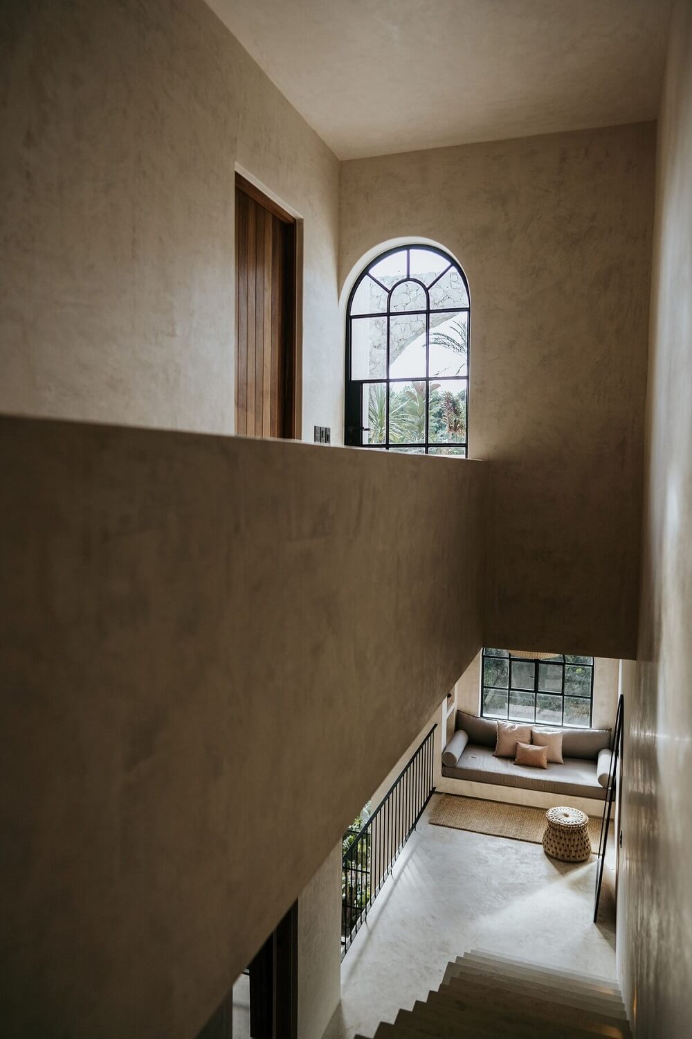 A Serene Apartment in Tulum with High Ceilings and Rooftop Pool 27 modern-architecture-airbnb-mexico-staircase-arched-window-nordroom