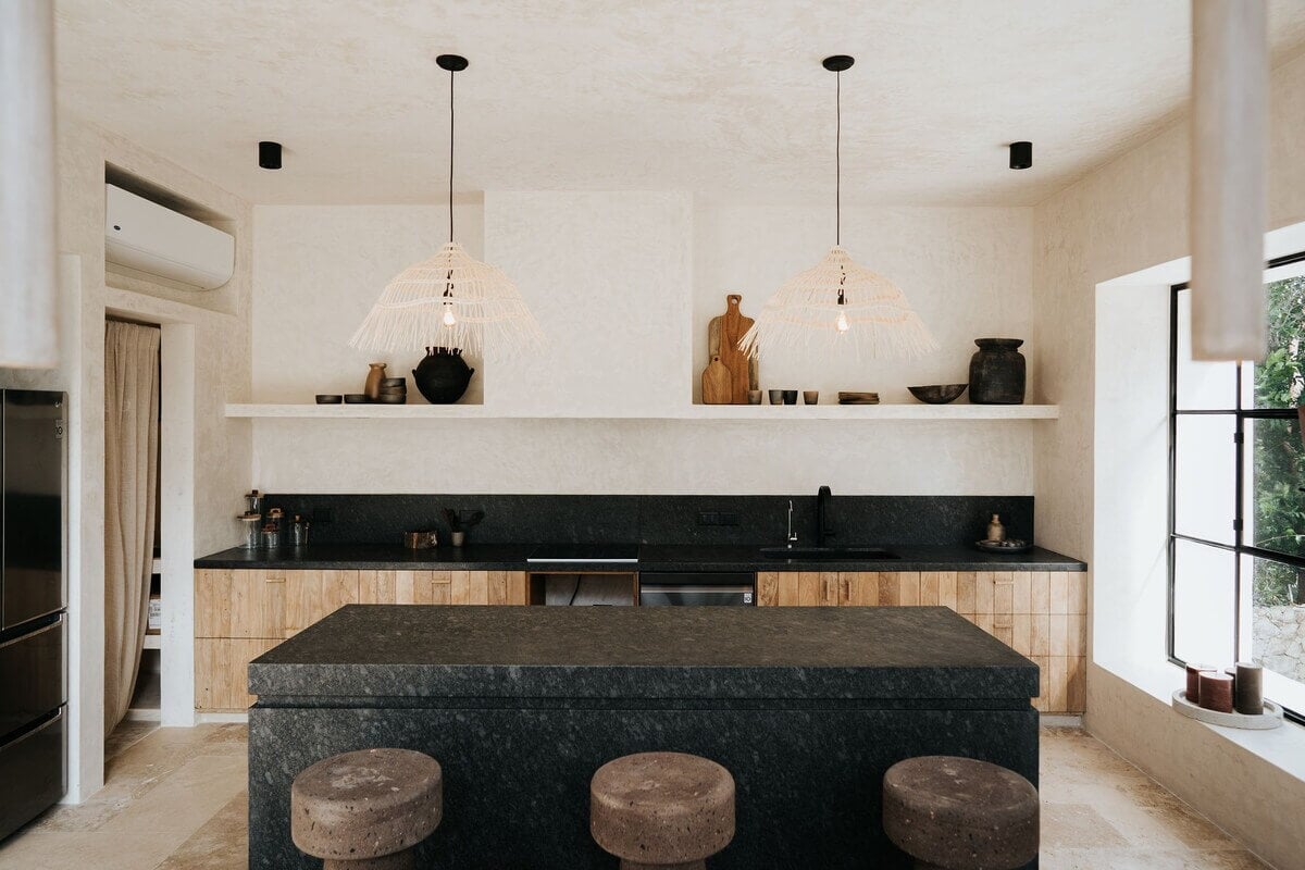 A Serene Apartment in Tulum with High Ceilings and Rooftop Pool 11 modern-kitchen-black-island-worktop-nordroom
