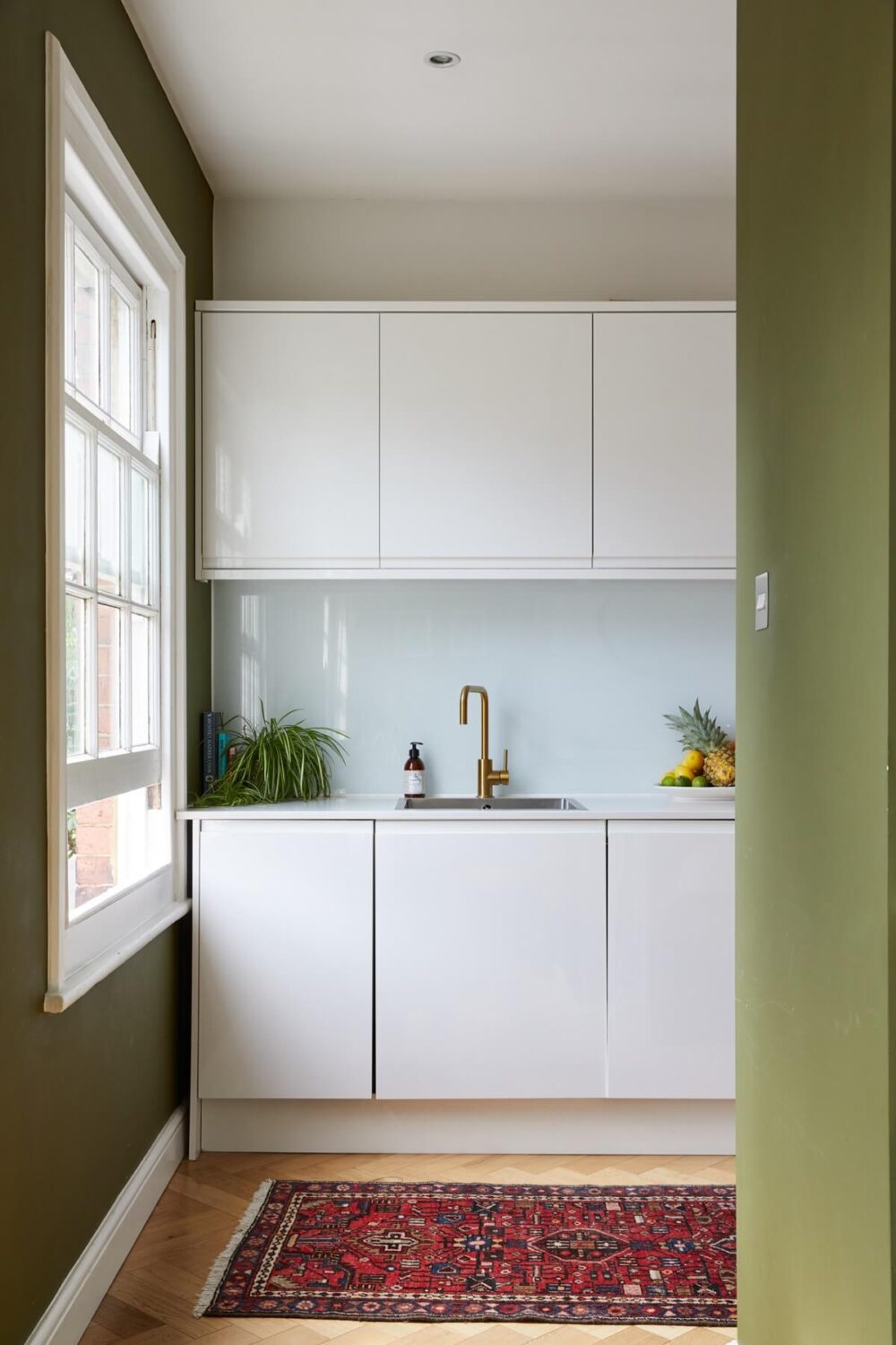 A London Apartment with Olive Green Living Room 6 modern-white-kitchen-cabinets-vintage-rug-nordroom