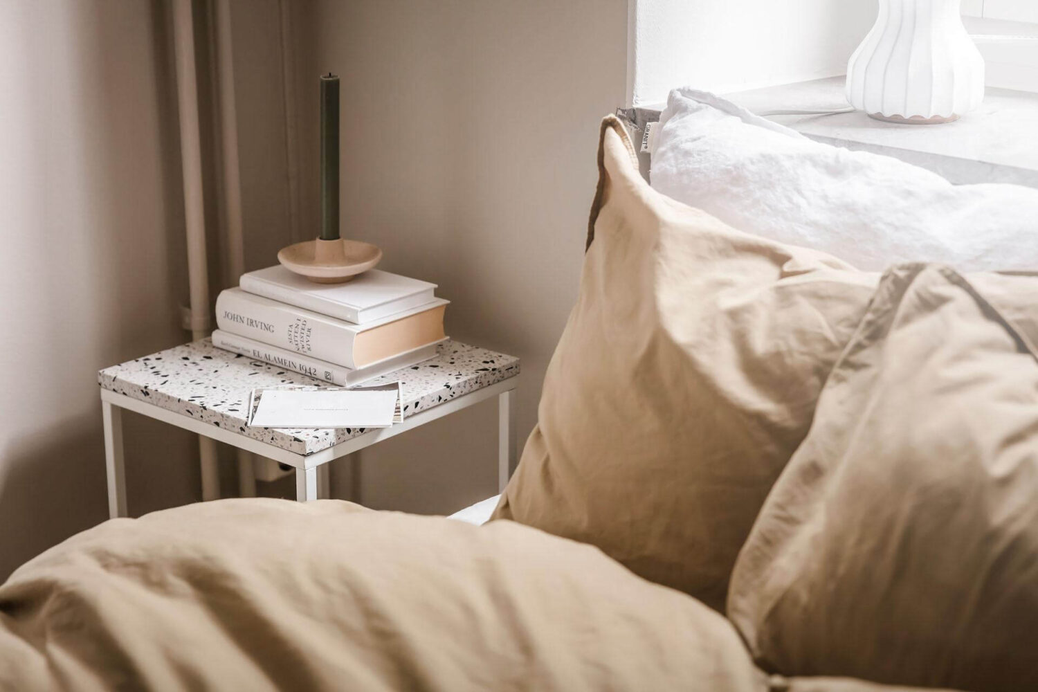 A Tiny and Stylish Nordic Apartment 18 narrow-bedroom-ochre-bedding-nightstand-nordroom