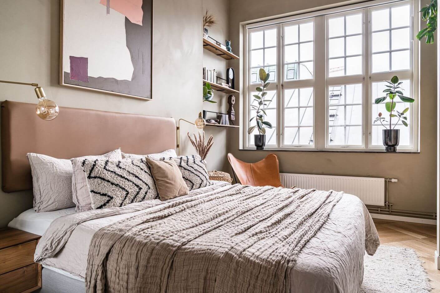 A Historic Factory Transformed Into A Stylish Home 20 neutral-scandinavian-bedroom-layered-textiles-shelves-nordroom