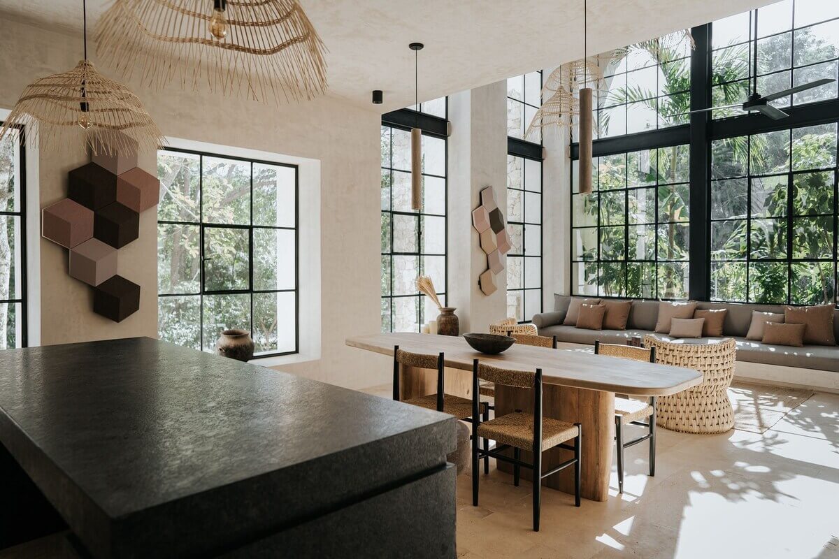 A Serene Apartment in Tulum with High Ceilings and Rooftop Pool 8 open-plan-living-space-black-kitchen-island-nordroom