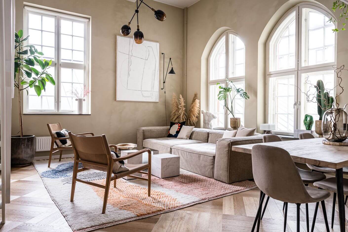 A Historic Factory Transformed Into A Stylish Home 5 open-plan-scandinavian-sitting-room-wood-floor-beige-walls-nordroom