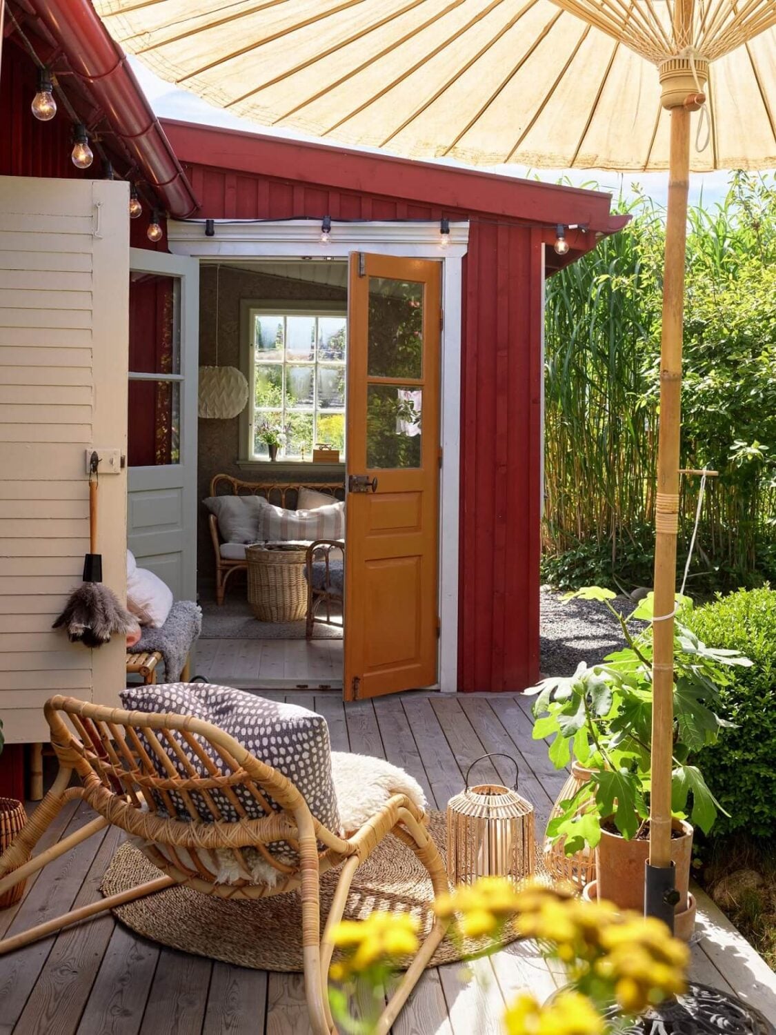A Cozy Renovated Cottage on a Swedish Allotment 24 outdoor-terrace-red-cottage-sweden-nordroom