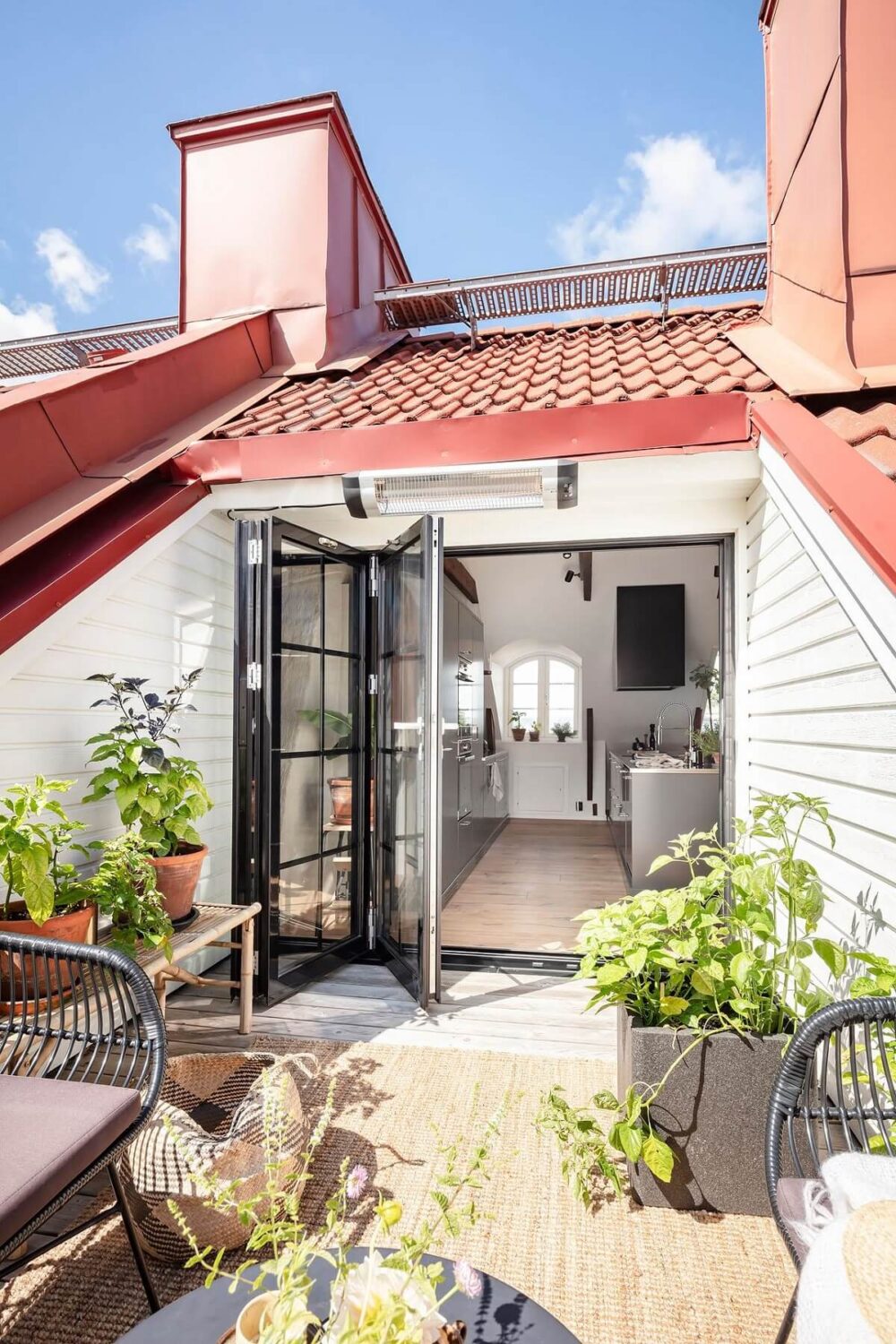 A Swedish Maisonette with Warm Pink Living Room 25 roof-terrace-kitchen-doors-nordroom