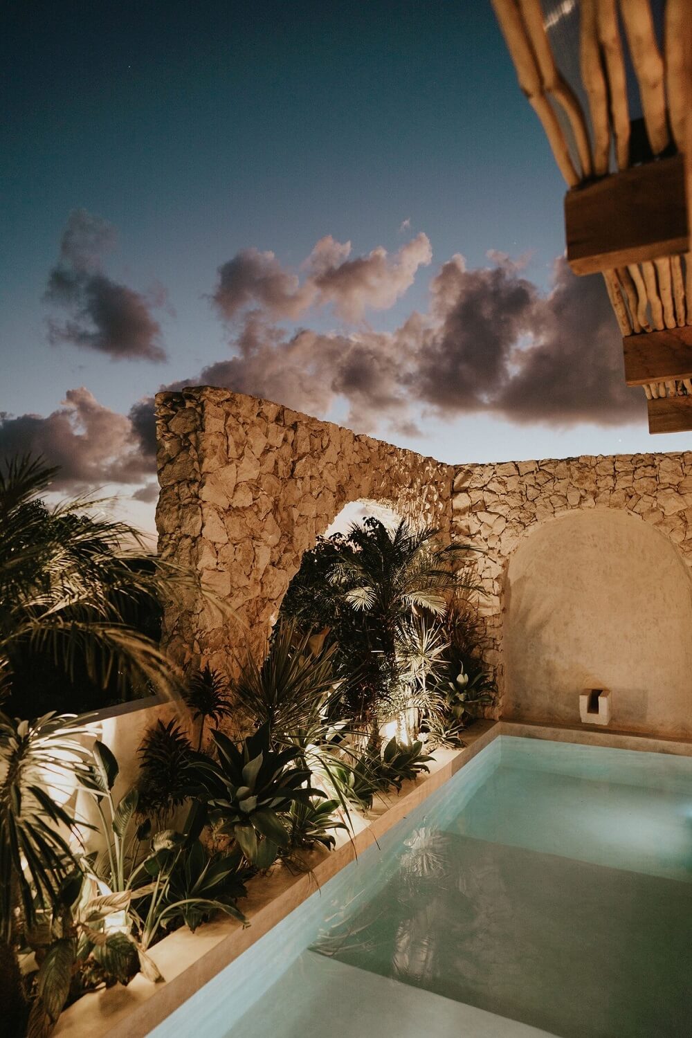 A Serene Apartment in Tulum with High Ceilings and Rooftop Pool 36 rooftop-pool-night-stone-wall-nordroom