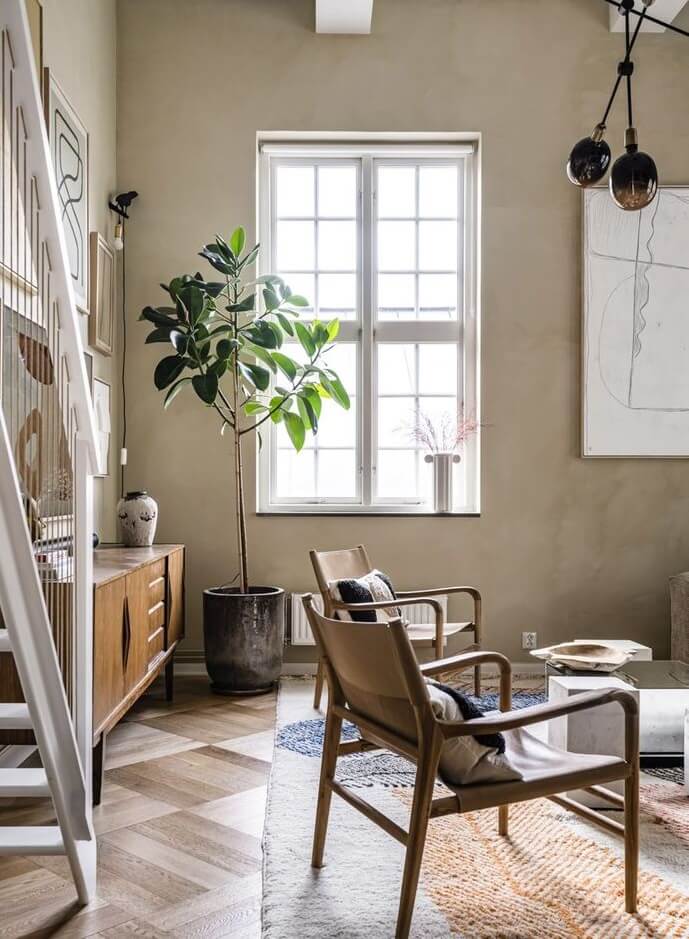 A Historic Factory Transformed Into A Stylish Home 2 scandinavian-living-room-high-ceilings-neutral-colors-nordroom