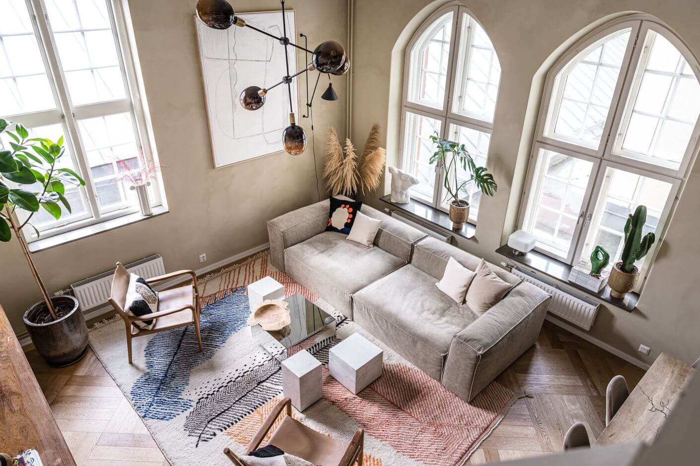 Best of 2022: Loft Apartments 12 serene-scandinavian-living-room-arched-windows-nordroom