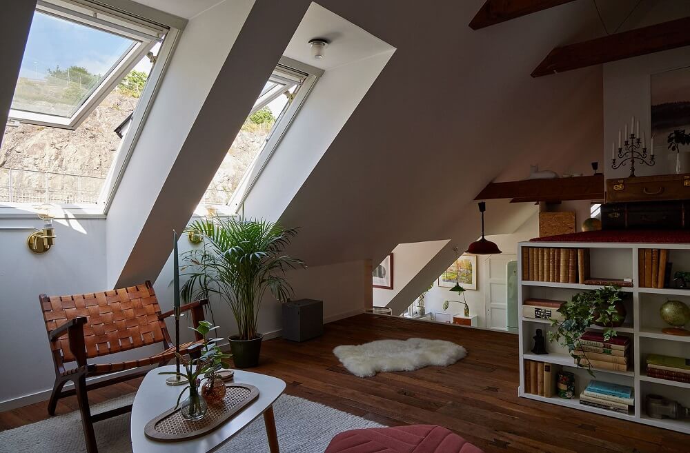 A Split-Level Attic Apartment with Blue Bedroom 9 sitting-room-attic-apartment-sloped-ceiling-exposed-beams-nordroom