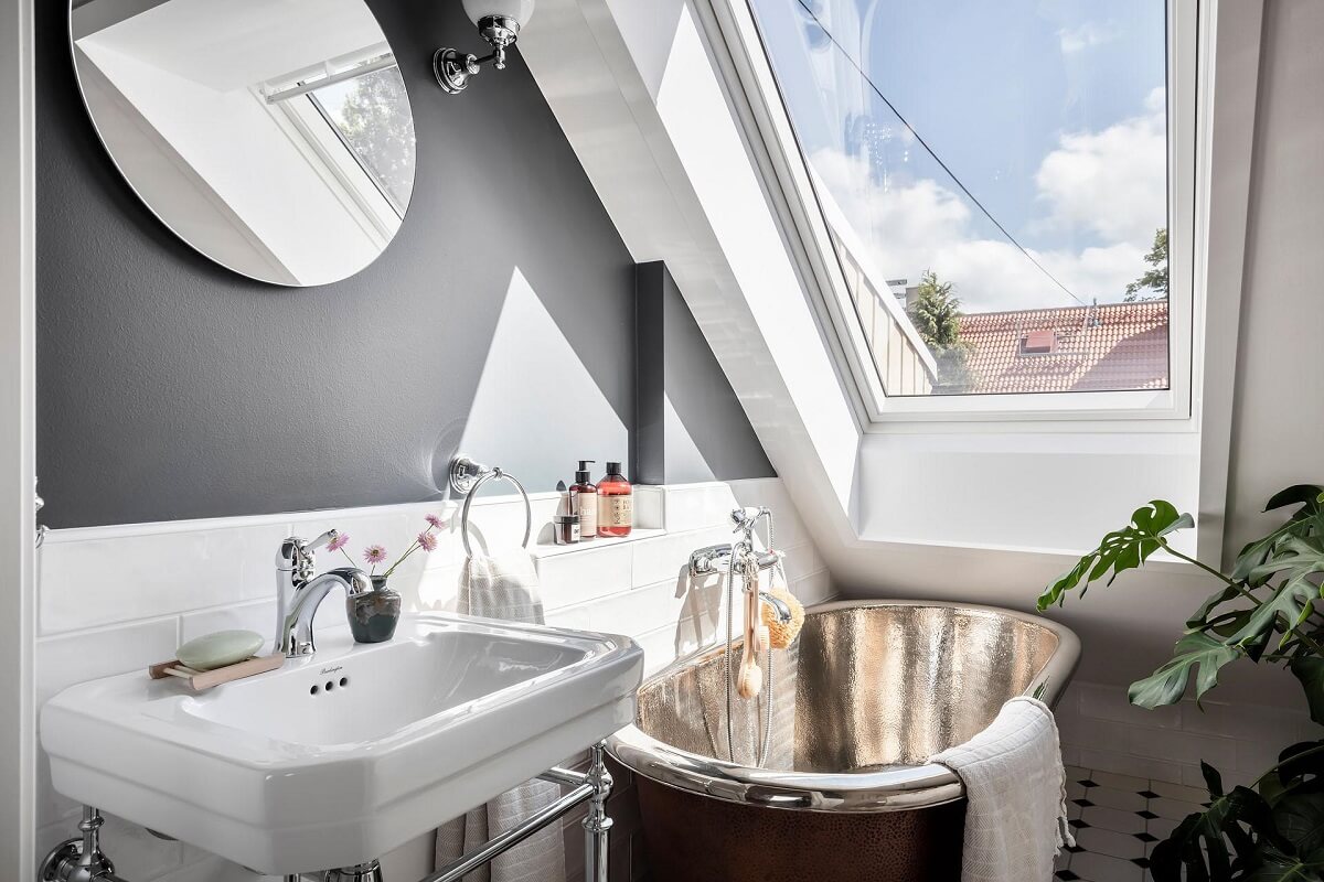 A Swedish Maisonette with Warm Pink Living Room 17 small-bathroom-slanted-ceiling-gray-walls-round-mirror-nordroom