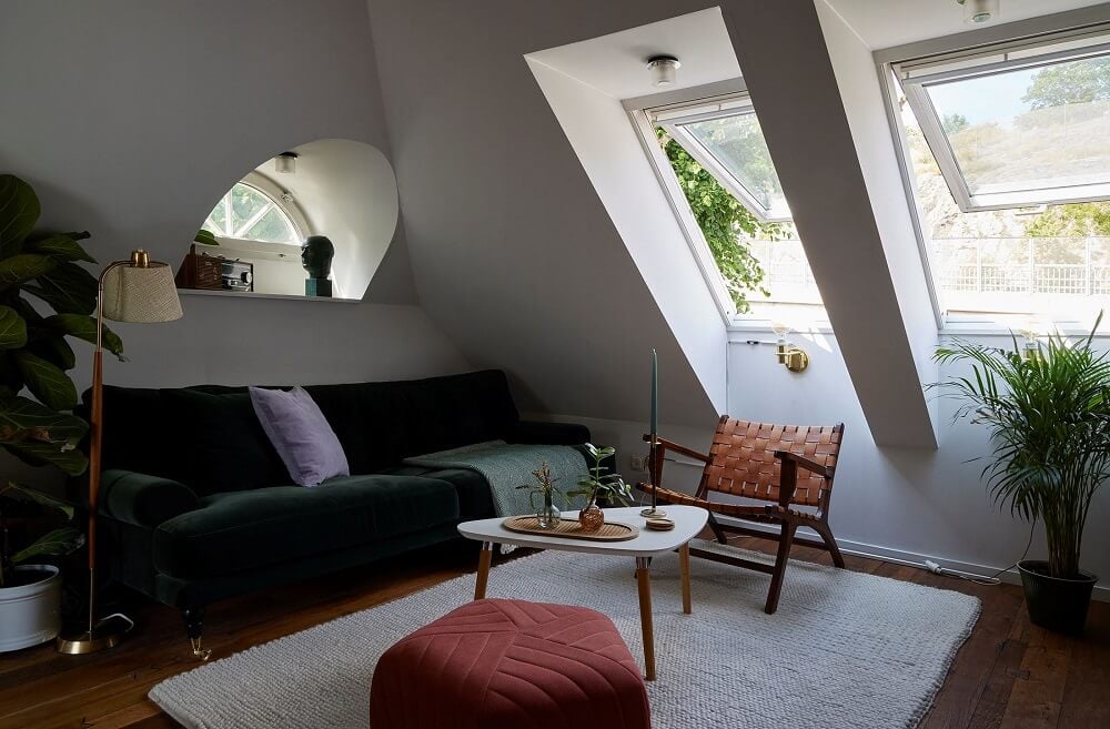 A Split-Level Attic Apartment with Blue Bedroom 7 small-living-room-sloped-ceiling-large-windows-nordroom