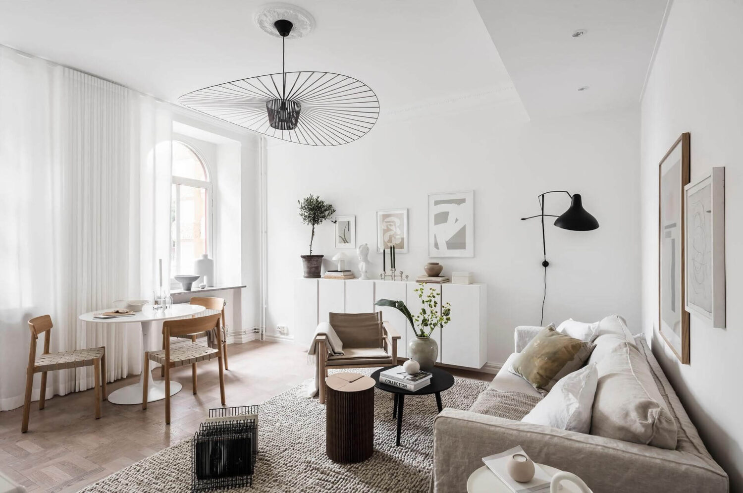 A Tiny and Stylish Nordic Apartment 1 small nordic living room round dining table nordroom A Tiny and Stylish Nordic Apartment