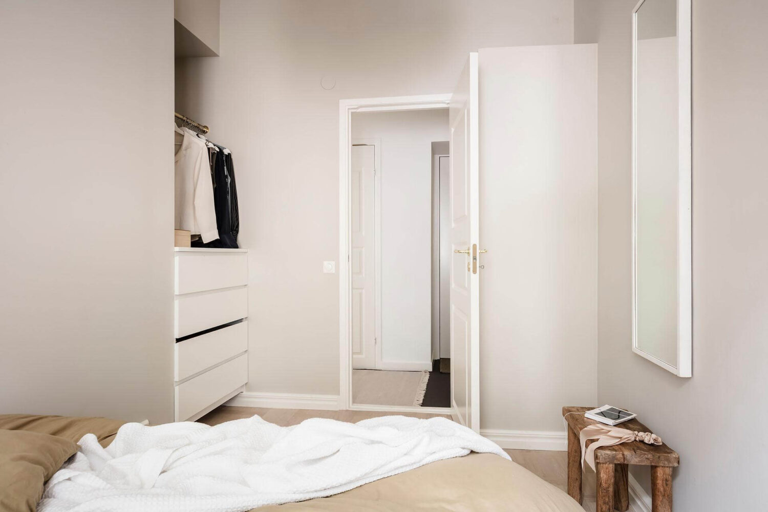 A Tiny and Stylish Nordic Apartment 22 small-scandinavian-bedroom-wardrobe-nook-mirror-nordroom