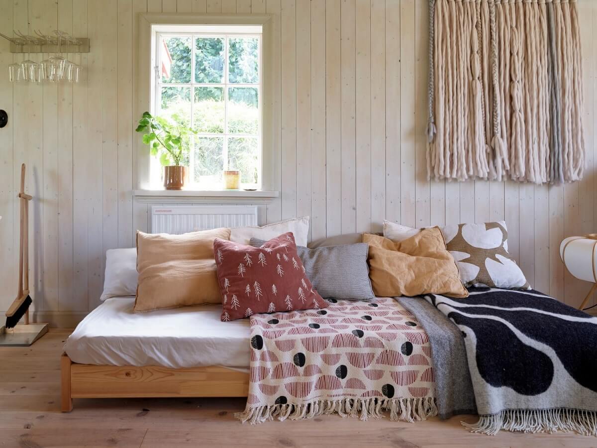 A Cozy Renovated Cottage on a Swedish Allotment 7 sofa-swedish-summerhouse-nordroom
