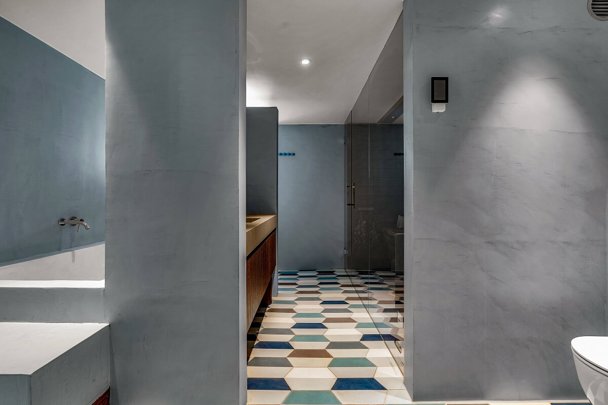 Bold Colors in a 1920s Villa in Sweden 22 spa-bathroom-gray-walls-olorful-floor-tiles-nordroom