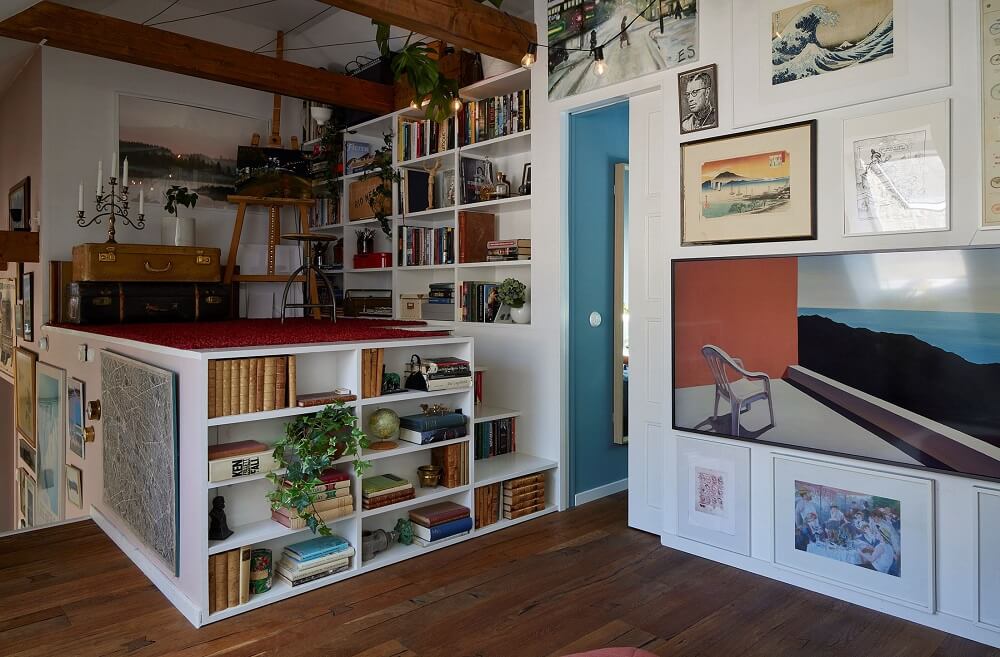 A Split-Level Attic Apartment with Blue Bedroom 10 split-level-iving-room-bookcases-vintage-art-nordroom