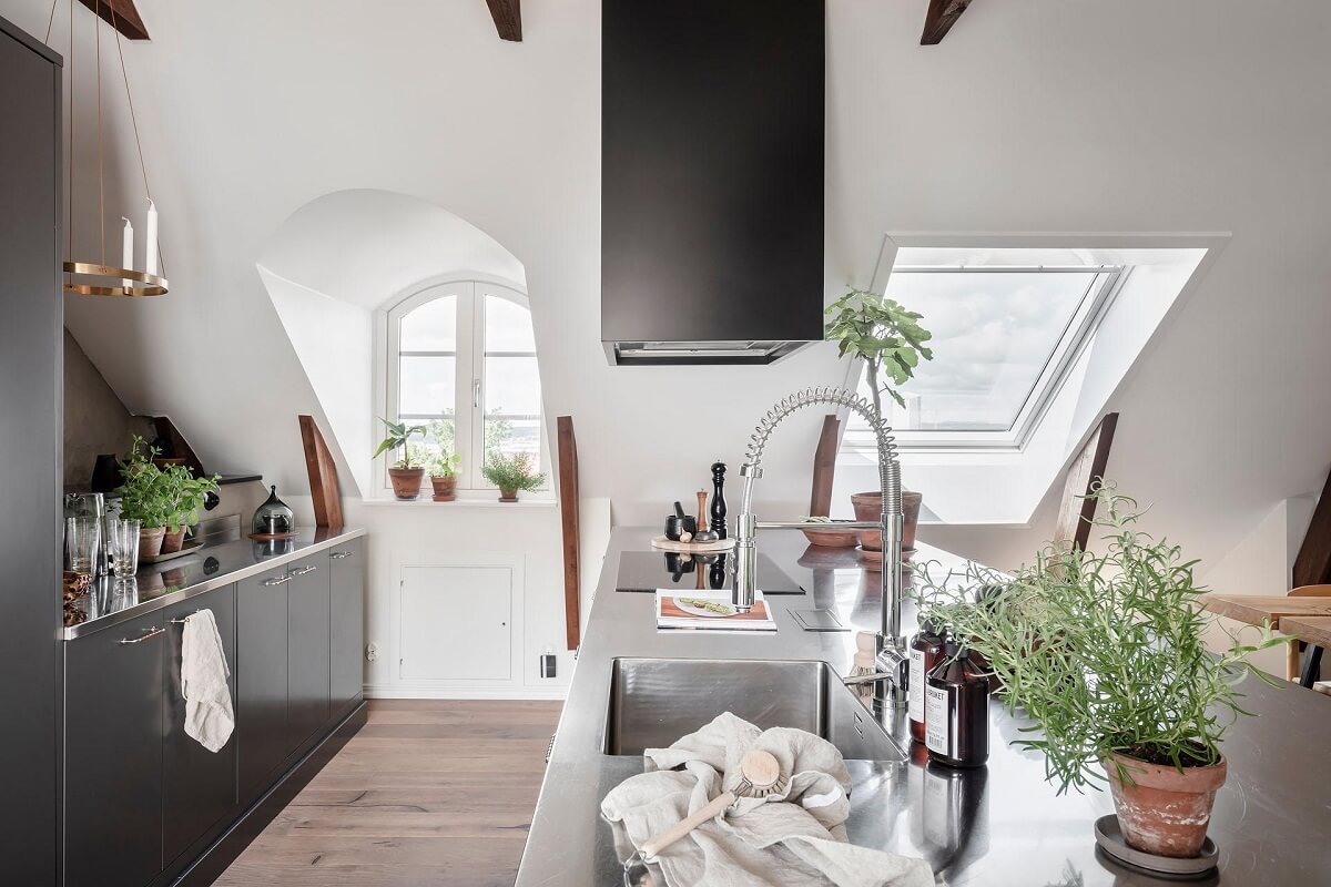 A Swedish Maisonette with Warm Pink Living Room 4 stainless-steel-kitchen-island-sloped-ceiling-nordroom